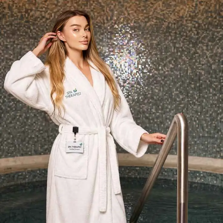 beautiful-spa-therapist-white-robe-pool-pose